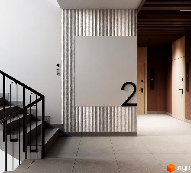 Інтер'єр холу Житлового комплексу MARVEL Home зі сходами, рельєфними панелями на стінах та вхідними дверима до квартир.