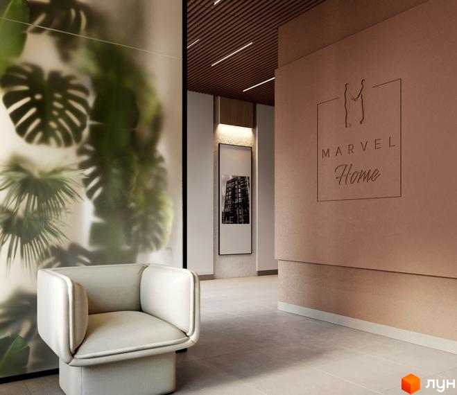 Житловий комплекс MARVEL Home: інтер'єр холу з м'яким кріслом, матовою скляною перегородкою з рослинами та логотипом. На стіні картина будівлі.