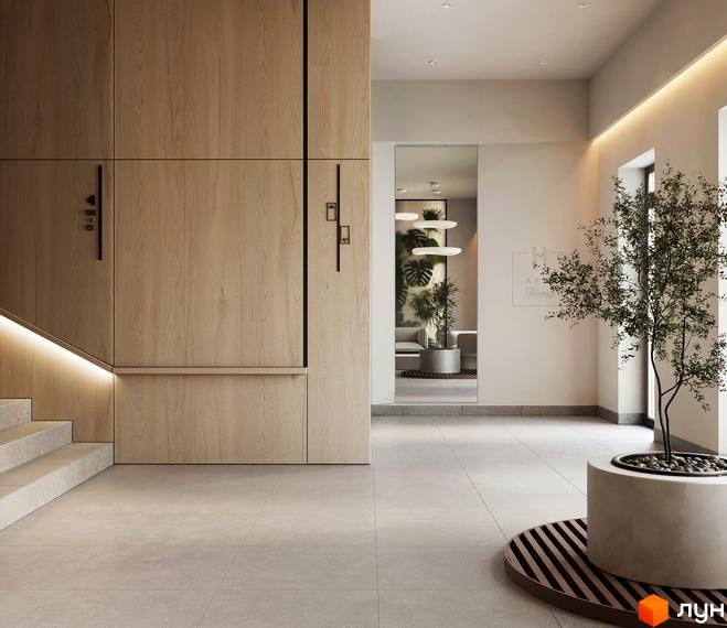 Вхідна група Житлового комплексу MARVEL Home з дерев'яними стіновими панелями, сходами з підсвічуванням та декоративною рослиною.