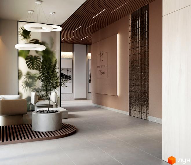Лобі житлового комплексу MARVEL Home з круглими світильниками, зеленою стіною та зоною очікування.