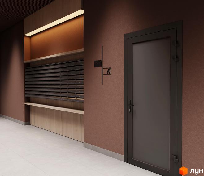 Внутрішній хол Житлового комплексу MARVEL Home з поштовими скриньками та вхідними дверима. Стіни оздоблені текстурною штукатуркою, присутнє освітлення.