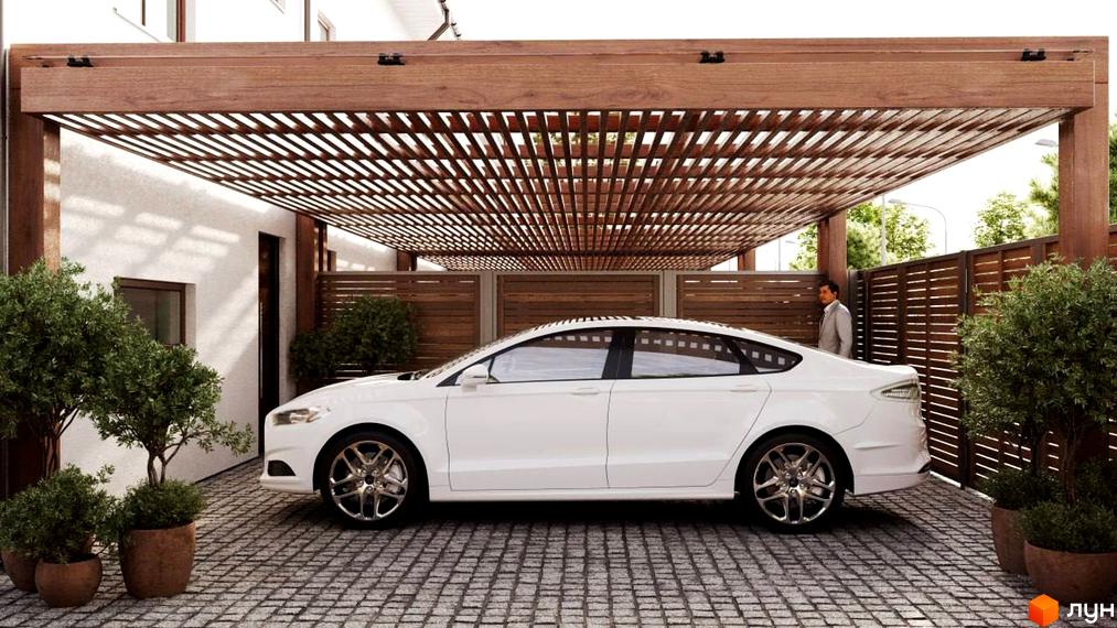 Таунхауси S8: білий седан під дерев'яним навісом на бруківці, поруч зелені кущі та паркан.