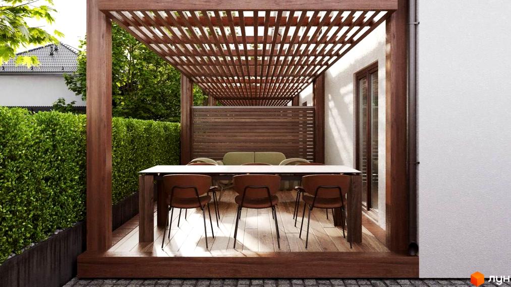 Таунхауси S8: затишна тераса з обіднім столом та кріслами під дерев'яним навісом, оточена зеленою огорожею.