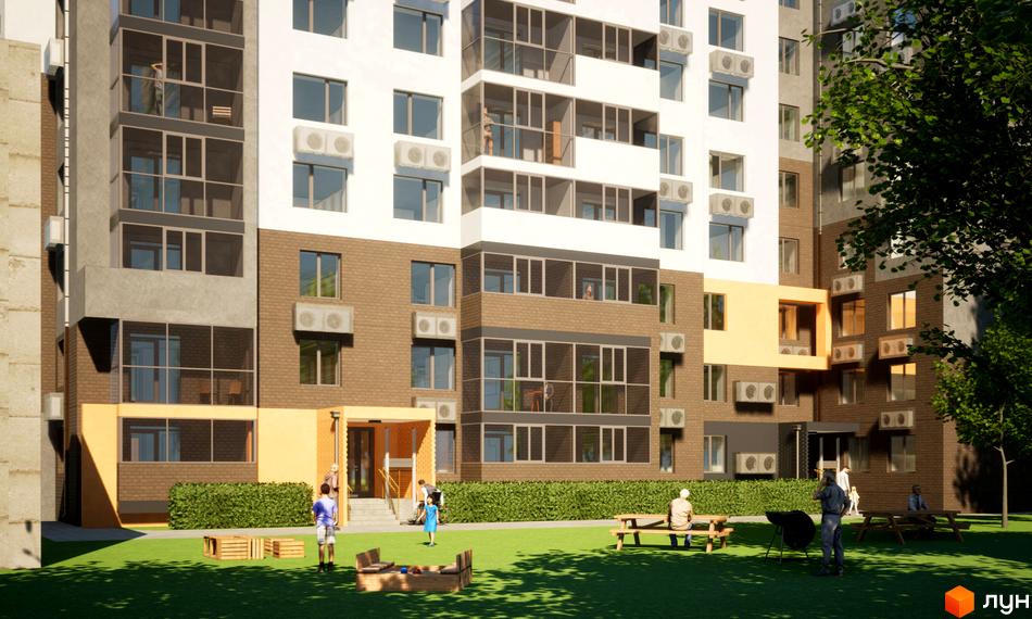 Висотна будівля ЖК Видовий з фасадом з білої та коричневої цегли. На прибудинковій території зелена трава, лавки та дитячий майданчик.