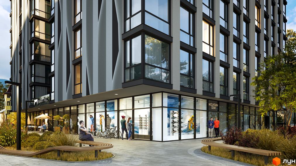 Апарт-комплекс Smart Hill з фасадом з вертикальних смуг та великими вікнами. Прибудинкова територія з лавками та зеленими насадженнями.