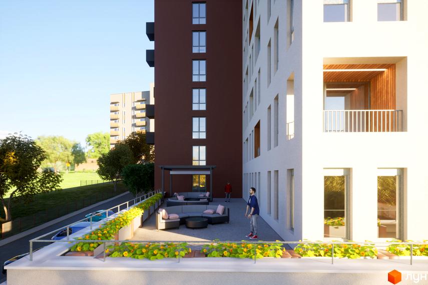 Житловий комплекс САБ Борислав з терасою та квітами. Зовнішній вигляд будинку з вікнами та балконами.