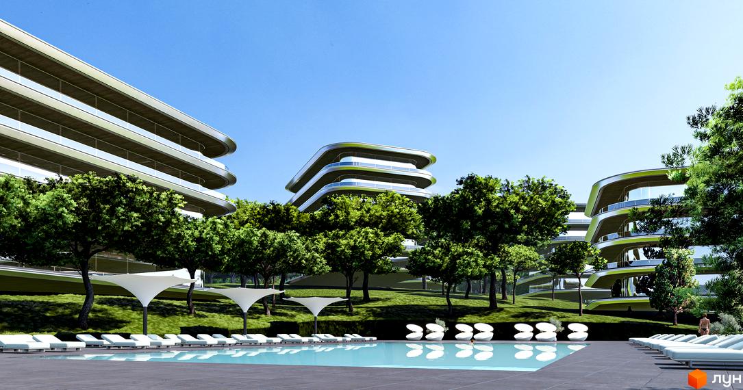 Апарт-комплекс GRAND FAMILY ЗАКАРПАТТЯ з басейном та шезлонгами на тлі зелених дерев та блакитного неба. Сучасна архітектура з вигнутими балконами.