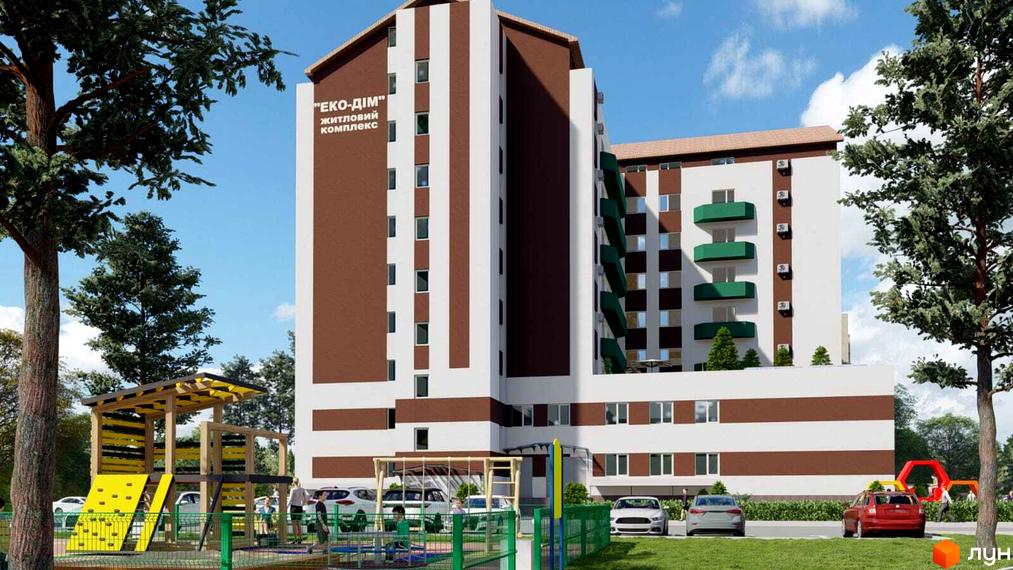 Житловий комплекс Еко Дім з коричнево-білими фасадами та зеленими балконами. На прибудинковій території дитячий майданчик та припарковані автомобілі.