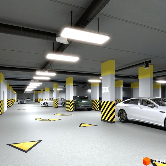 Підземний паркінг ЖК LAKETOWN з яскравими жовтими стрілками напрямку руху та паркувальними місцями. Сучасний паркінг новобудови.