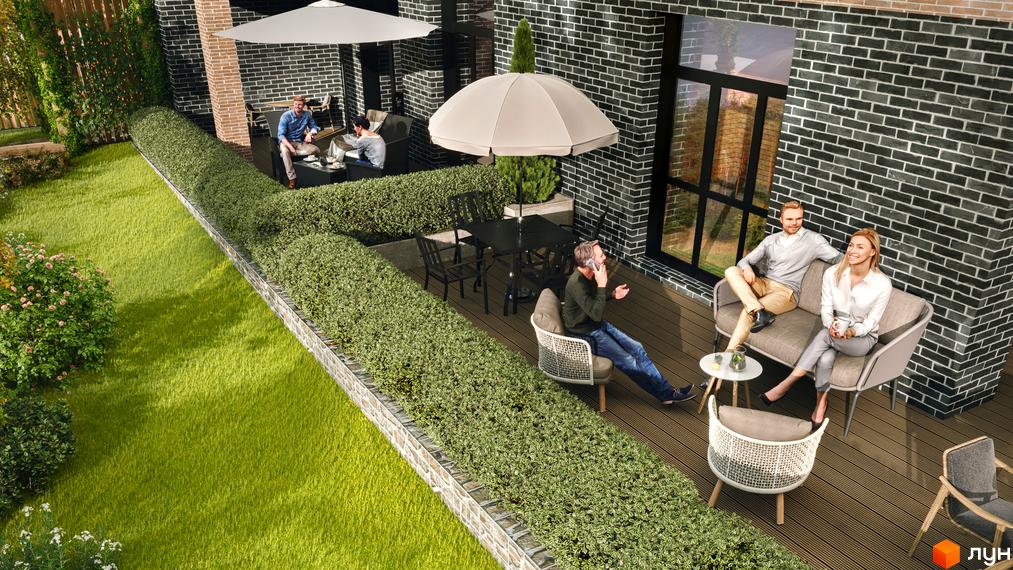 Житловий комплекс Масив Преміум: фасад будинку з темної цегли, простора тераса з дерев'яним настилом та зеленим газоном.