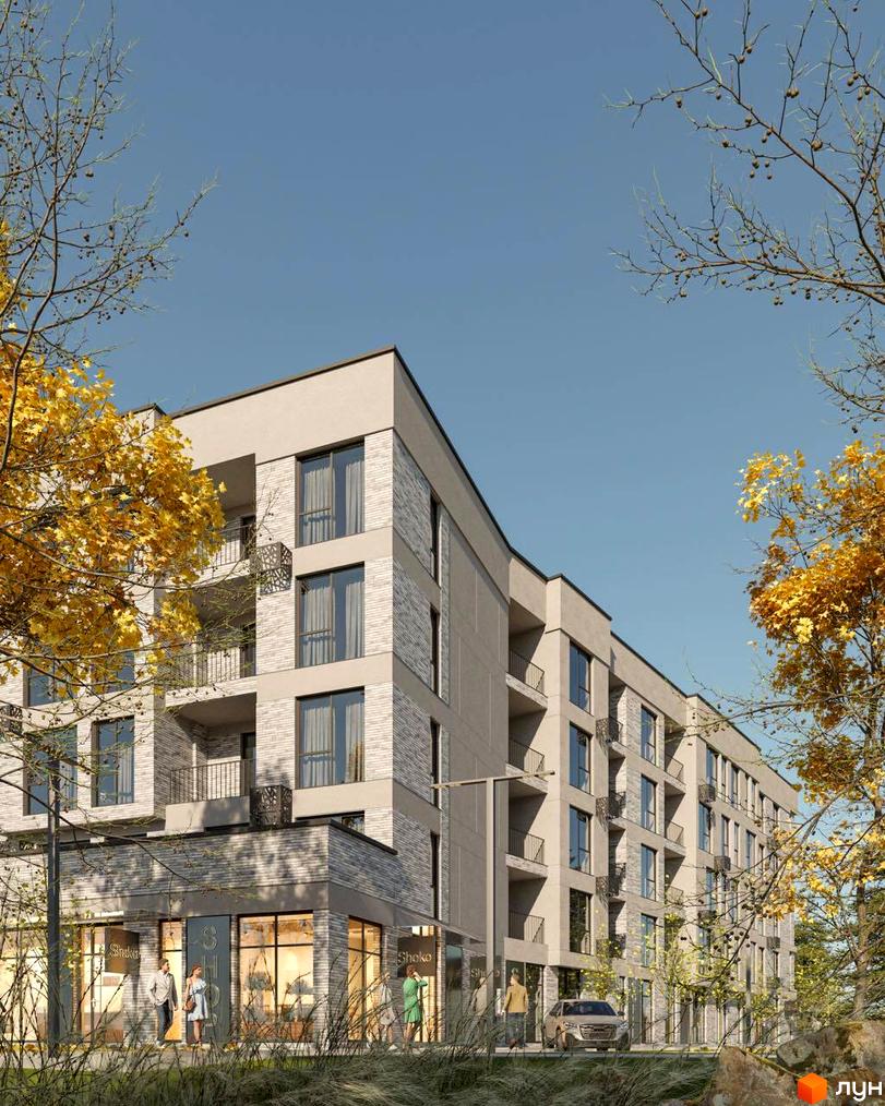 Висотна будівля житлового комплексу з великими вікнами та балконами. На першому поверсі розташовані магазини. Поруч дерева з жовтим листям.