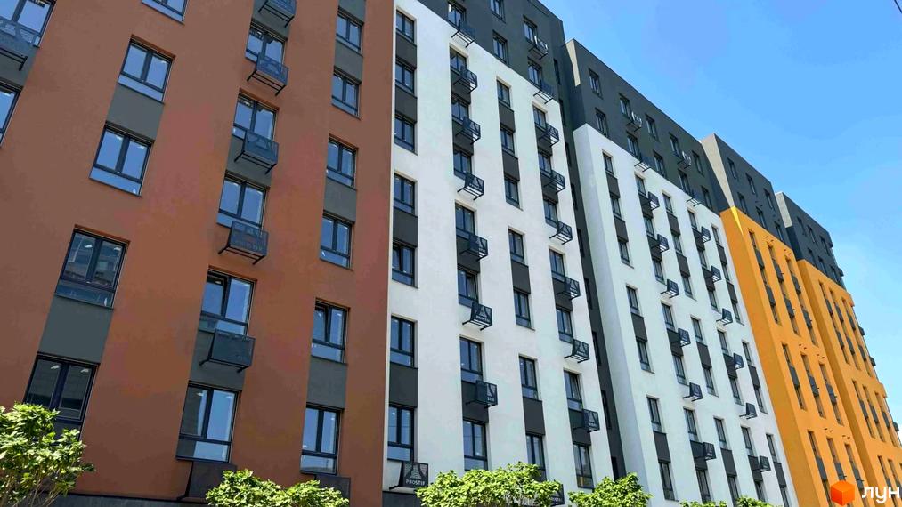 Фасад житлового комплексу Osnova з коричневими, білими та жовтими секціями, вікнами та балконами. Зелені дерева біля будинку.