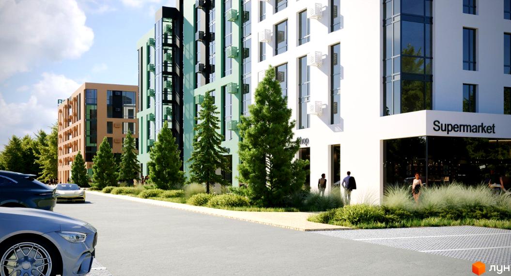 Житловий комплекс Хвоя з фасадами світло-зеленого та бежевого кольорів, розташований біля дороги з припаркованими автомобілями та зеленою зоною.