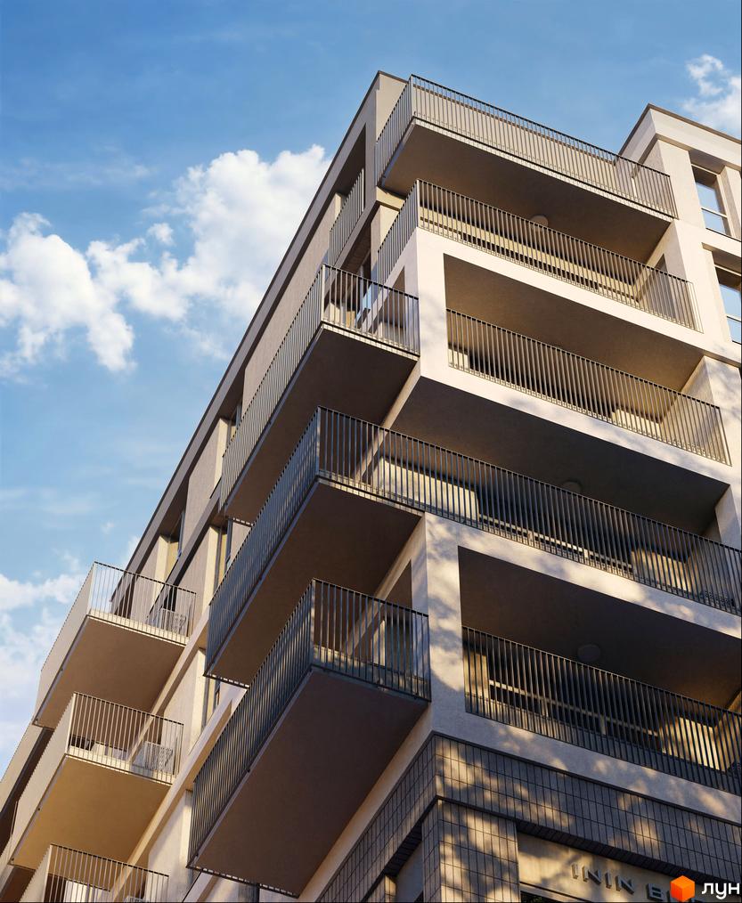 Зображення Житлового комплексу Avalon Magnolia з багаторівневими балконами та вертикальними перилами. Видно світлий фасад будівлі під яскравим небом.