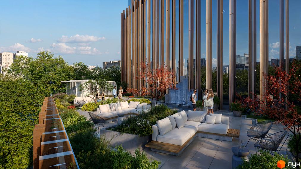 Тераса житлового комплексу THE ONE з вишуканими диванами та зеленню. Фасад будівлі прикрашений вертикальними дерев'яними елементами.