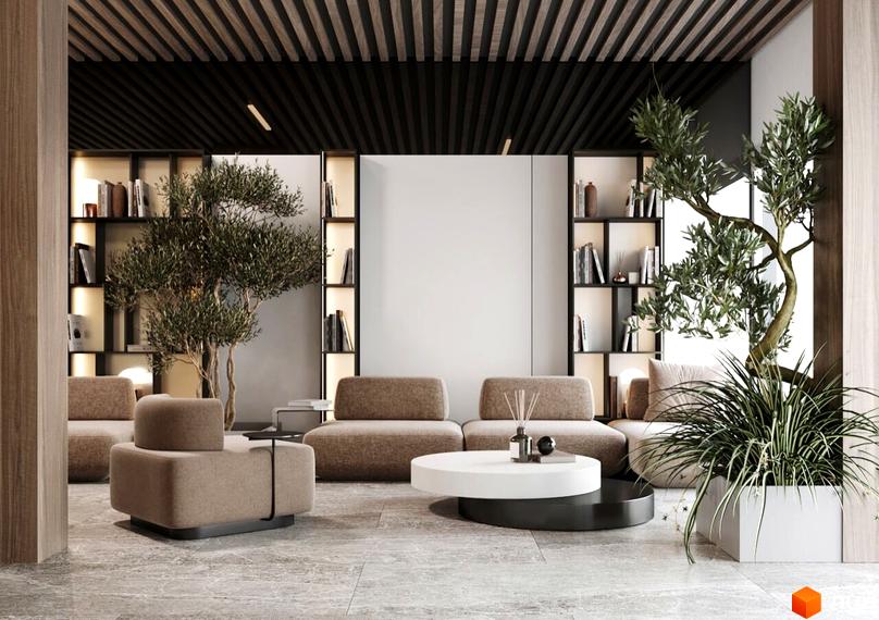 Інтер'єр зони відпочинку в житловому комплексі INFINITY PARK з диванами, деревами та книжковими полицями.