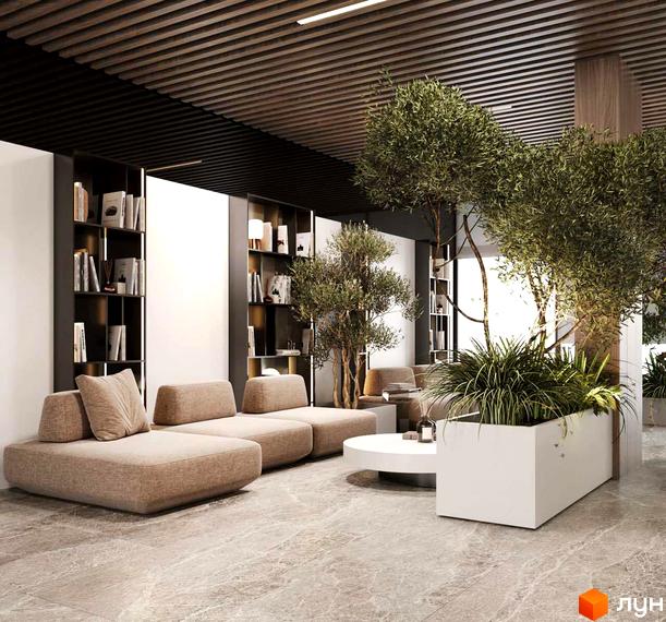 Інтер'єр лобі житлового комплексу INFINITY PARK з диванами, книжковими шафами та зеленими рослинами. Простір для відпочинку та роботи.