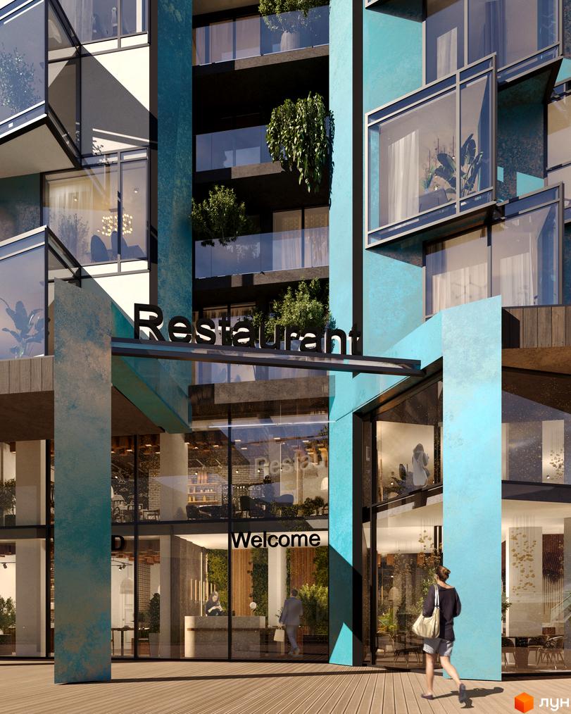 Зовнішній вигляд новобудови ЖК Royal Park з фасадом блакитного кольору та великими вікнами. Вхід до будівлі прикрашений написом 