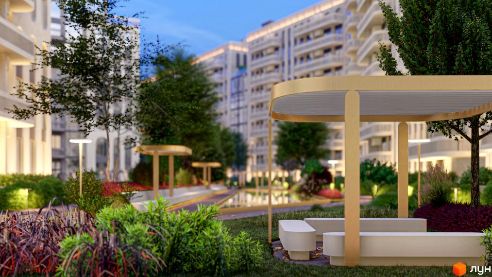 Житловий комплекс RESIDENTS AVENUE. Зона відпочинку з лавками та навісом на тлі багатоповерхових будинків та озеленення.