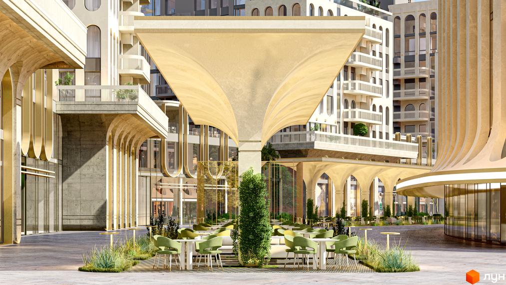 Житловий комплекс RESIDENTS AVENUE з архітектурою у стилі ар-деко та затишною терасою з вуличними меблями.