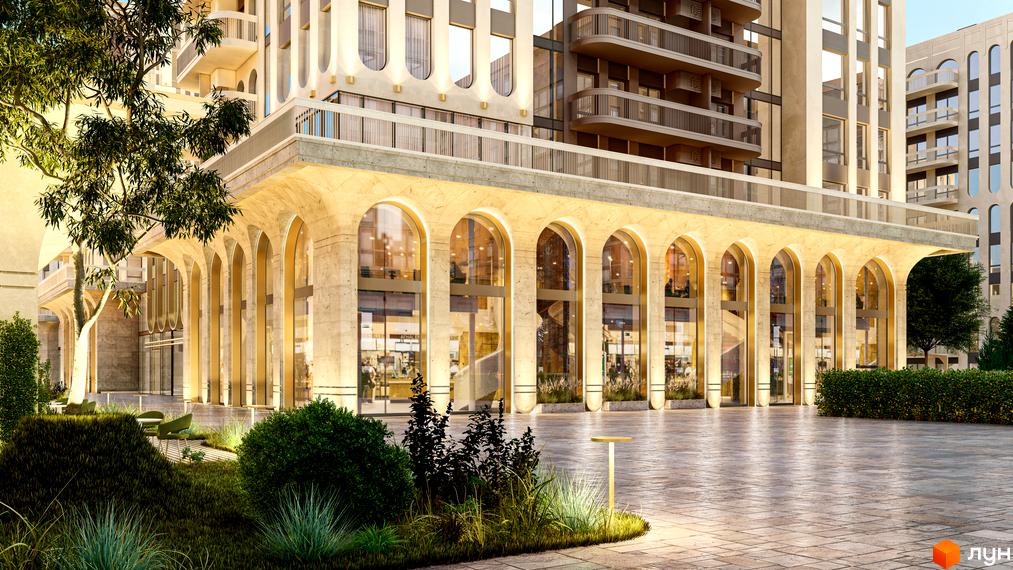 Житловий комплекс RESIDENTS AVENUE з аркадою на першому поверсі та доглянутою прибудинковою територією з деревами та кущами.