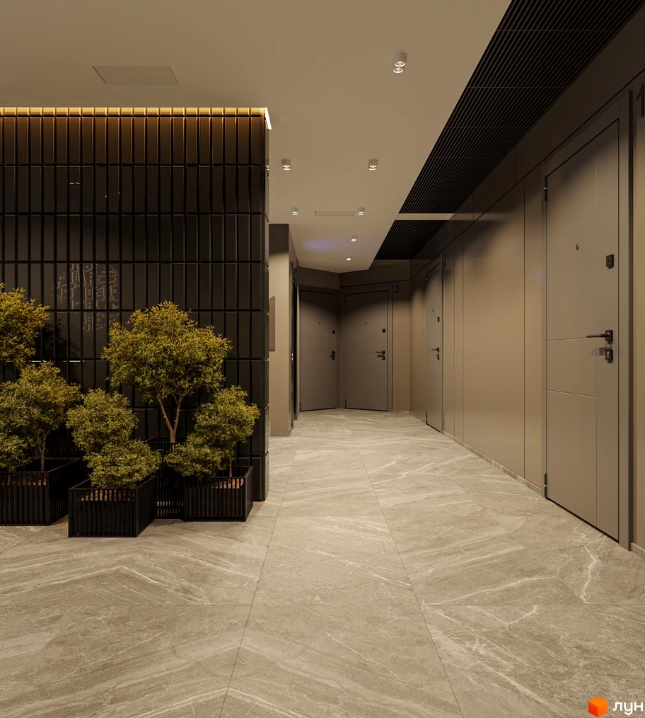 Сучасний коридор новобудови з дверима та рослинами у горщиках. Оздоблення стін та підлоги виконано в нейтральних тонах.