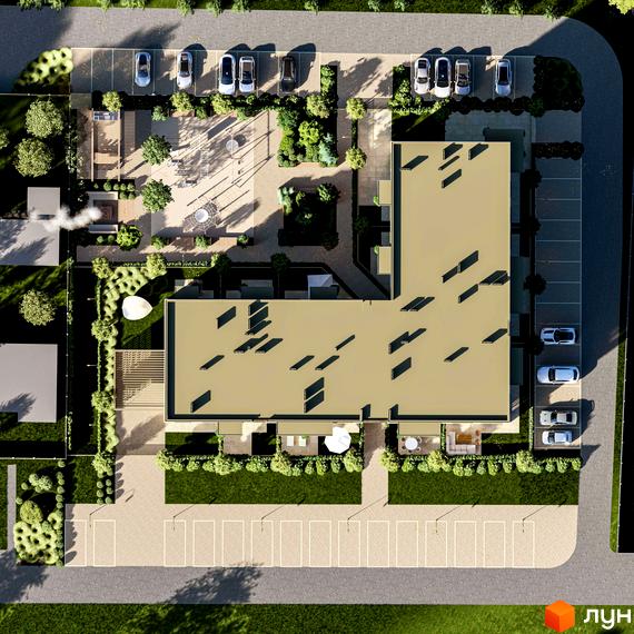 Вид зверху на Г-подібний будинок Житлового комплексу Минай з пласким дахом. Прибудинкова територія включає парковки, зелені насадження та дитячий майданчик.