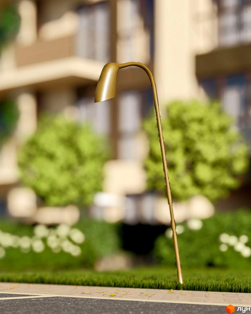 Будівля Житлового комплексу Минай світло-коричневого кольору, оточена зеленим газоном з деревами та вуличним ліхтарем.