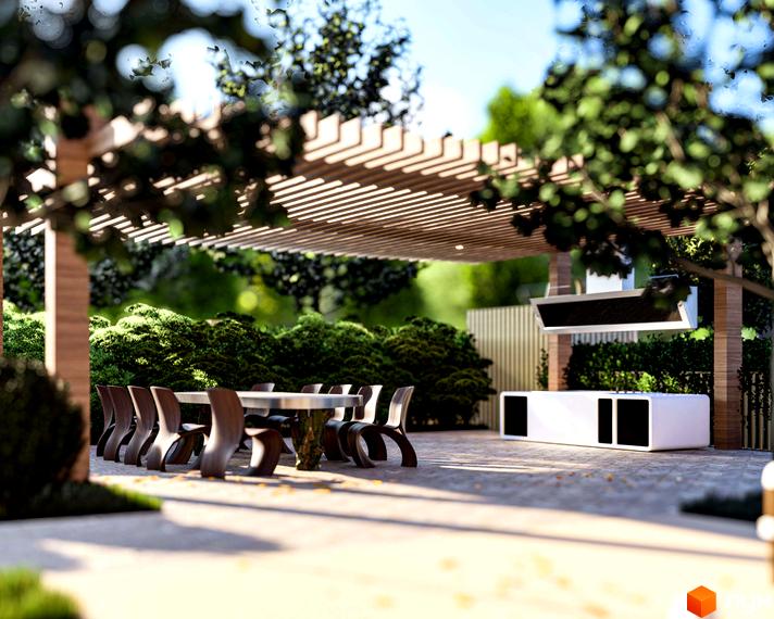 Облаштована прибудинкова територія Комплексу Минай: дерев'яна пергола, обідня зона з меблями та вулична кухня.