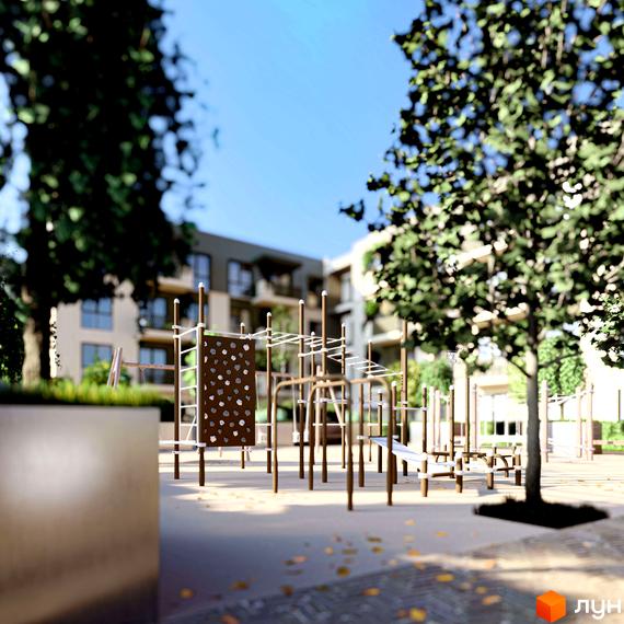 Вигляд на багатоповерхові будинки Житлового комплексу Минай та ігровий майданчик з турніками на прибудинковій території.