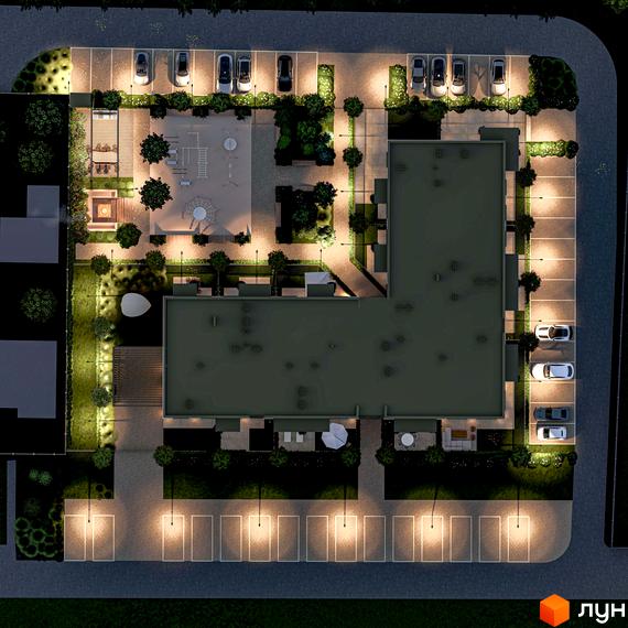 Нічний вид на Житловий комплекс Минай: багатоквартирний будинок Г-подібної форми та освітлена прибудинкова територія з паркінгом та дитячим майданчиком.