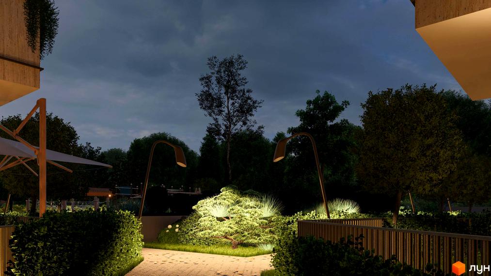 Вигляд будинку житлового комплексу Минай вночі. Освітлена прибудинкова територія з доріжками, деревами та ландшафтним дизайном.