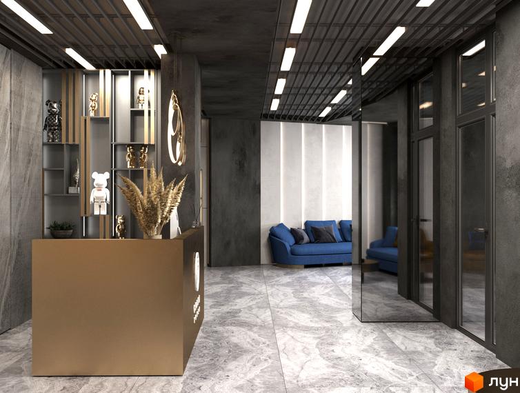 Житловий комплекс Grand Tower: інтер'єр лобі з золотистою стійкою реєстрації, синім диваном та дзеркальними стінами.