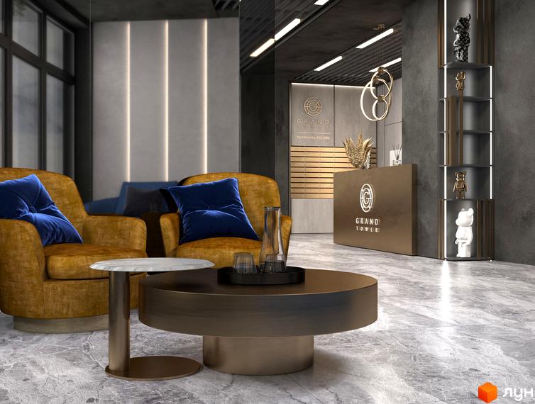 Зображення інтер'єру лобі житлового комплексу Grand Tower з м'якими меблями та стійкою рецепції. Зона очікування для мешканців.