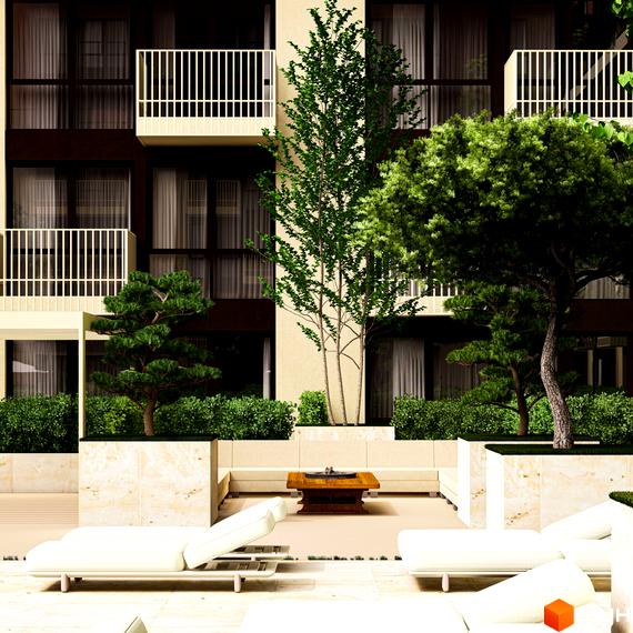 Житловий комплекс ЛАЙТ ПАРК з балконами та зеленими насадженнями. На прибудинковій території розташовані шезлонги та зона відпочинку.