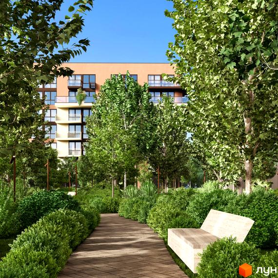 Новобудова ЛАЙТ ПАРК з фасадом світло-коричневого кольору та балконами. Доглянута прибудинкова територія з зеленими насадженнями та доріжкою.