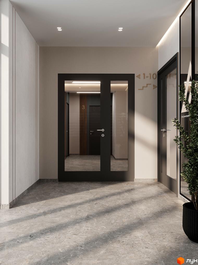 Сучасний вхід у житловий комплекс ATMOSFERA з дверима та дзеркальною стіною. На стіні вказівники поверхів та номерів квартир.