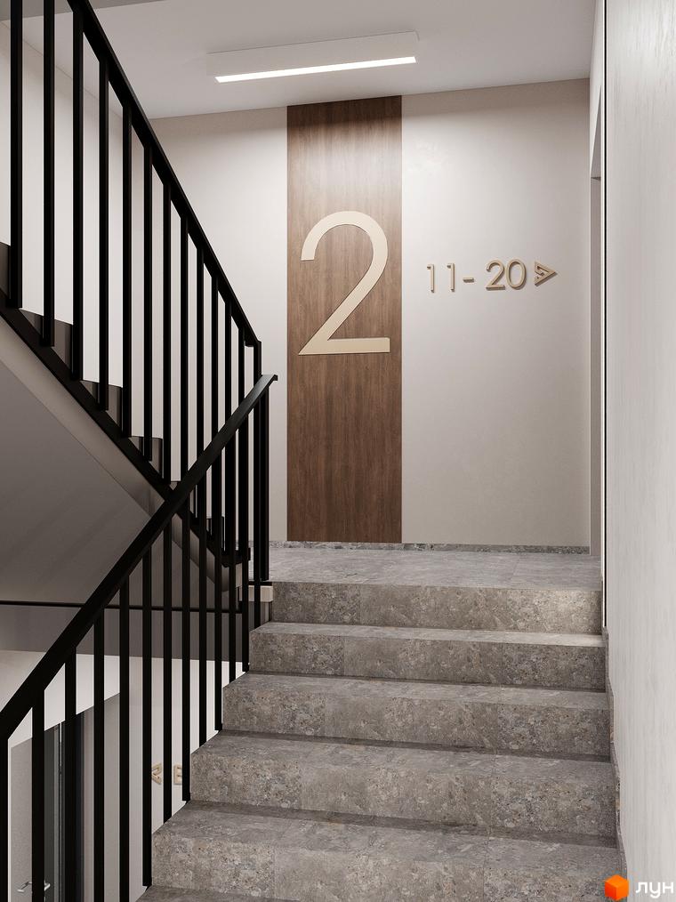 Сходи в ЖК ATMOSFERA з чорними перилами та великою цифрою 2 на стіні. Сучасний дизайн сходів та оздоблення стін створюють комфортний простір.