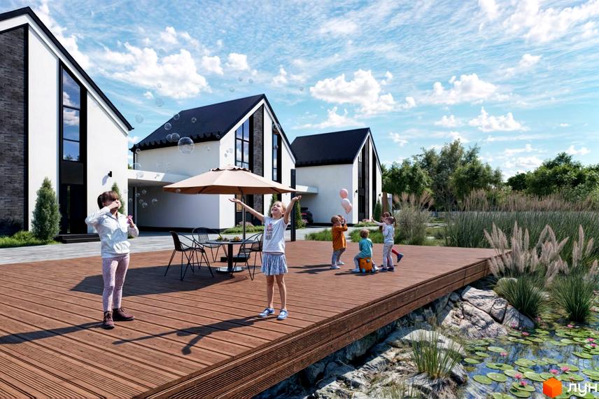 Котеджне містечко DESNA HOMES. Будинки з чорними дахами та білими стінами, тераса з дітьми, що пускають мильні бульбашки, та водойма з ліліями.