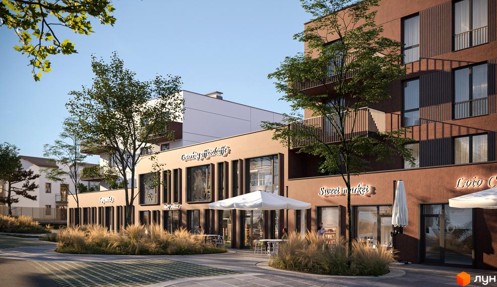 Фасад будівлі ЖК SUMMERSTONE VILLAGE з комерційними приміщеннями на першому поверсі та озелененою прибудинковою територією.