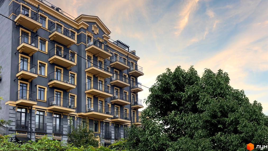 Житловий комплекс Вентімілья - це багатоповерхова будівля з балконами та вікнами, оточена зеленню.