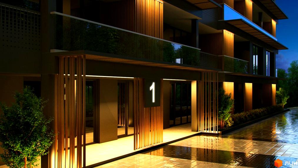 Зображення фасаду будинку Житлового комплексу OZONE з підсвіткою та номер будинку 1. Навколо будівлі висаджені зелені насадження.