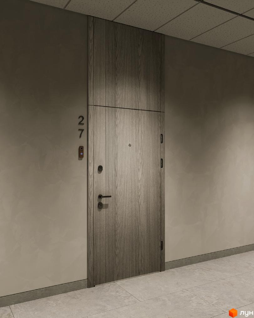 Двері квартири в ЖК Зелений з дерев'яною обшивкою. На стіні номер квартири 27 та кнопка виклику.