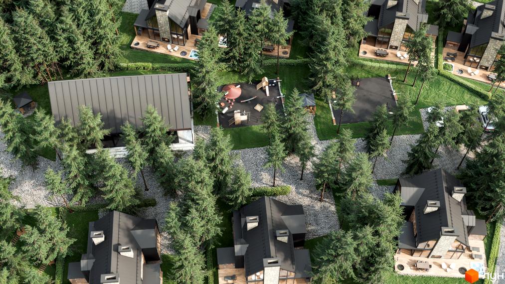 Вид зверху на котеджі Guta Nova з темними дахами та великими вікнами. Територія комплексу має багато хвойних дерев, гравійні доріжки та дитячий майданчик.