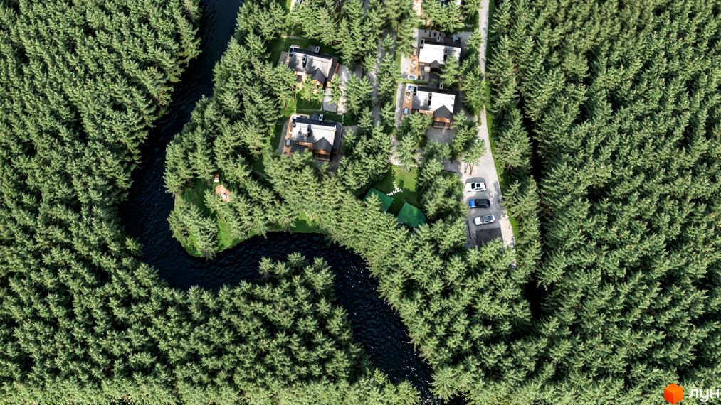 Вид зверху на котеджі в лісі біля річки. На території Житлового комплексу Guta Nova розташовані будинки та парковка.