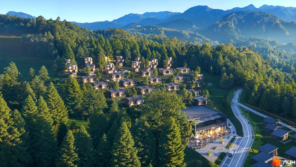 Котеджне містечко Малахіт: будинки різних форм, включаючи циліндричні, на схилі пагорба. Комплекс оточений лісом, горами та має дорогу.