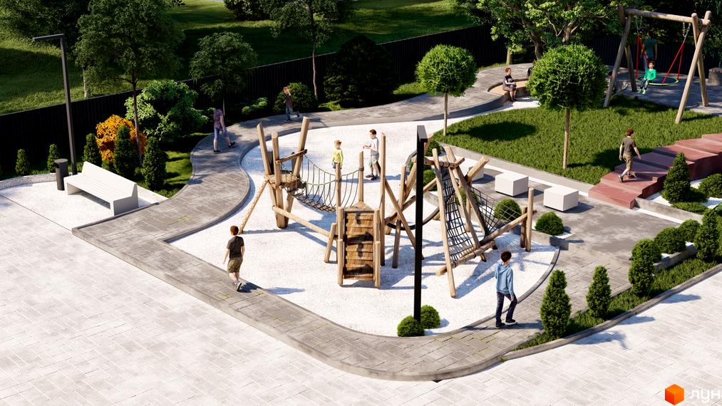 Дитячий майданчик з дерев'яними конструкціями та гойдалками в ЖК Рубін Апартамент. Територія комплексу озеленена, є зони відпочинку з лавками.