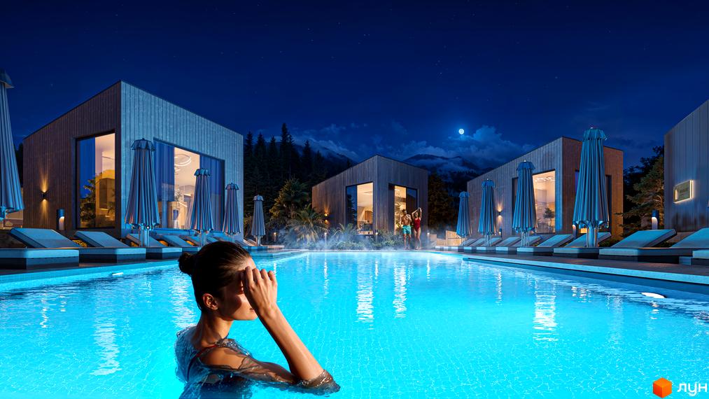 Котеджне містечко Malachite з басейном вночі. Житло з басейном, лежаками та парасольками для відпочинку.