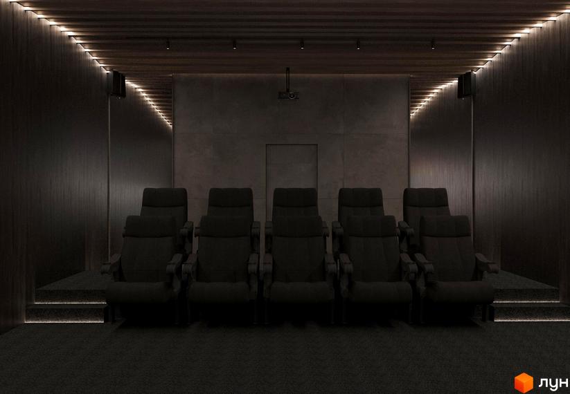 Кімната для перегляду кіно у Котеджному містечку Малахіт. М'які крісла для глядачів, темні стіни та стеля, приглушене освітлення.