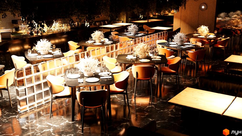 Інтер'єр ресторану Котеджного містечка Малахіт з обідніми столами, світлими кріслами та скляними блоками. Приміщення прикрашене рослинами, підлога темна.